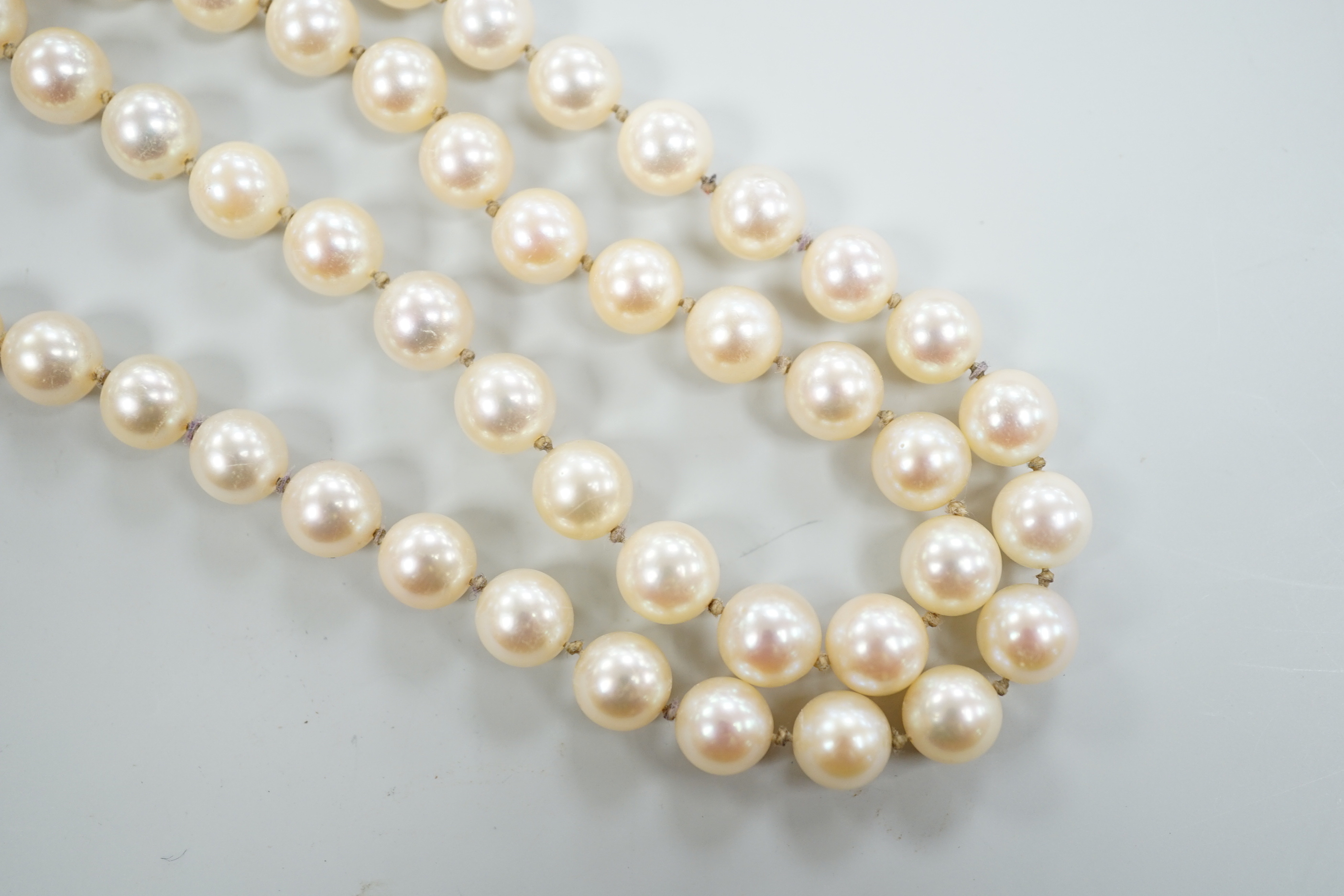 A single strand cultured pearl necklace, with diamond set 18ct white gold clasp, 48cm.